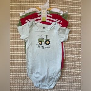 Four NWT Hudson Baby short-sleeved onesies